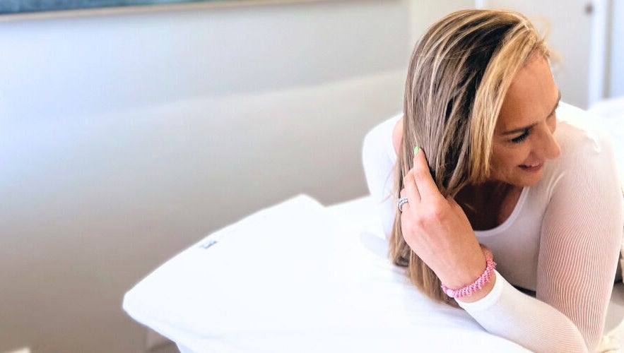 A woman relaxes on a massage bed at Endermologie & Slimming, Somerset West, Western Cape, ZA.