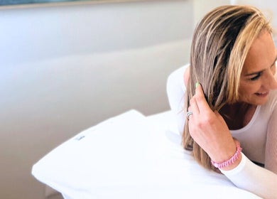 A woman relaxes on a massage bed at Endermologie & Slimming, Somerset West, Western Cape, ZA.