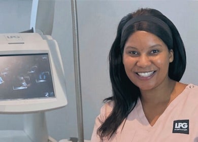 Friendly technician beside LPG machine at Endermologie & Slimming in SOMERSET WEST, Western Cape, ZA.