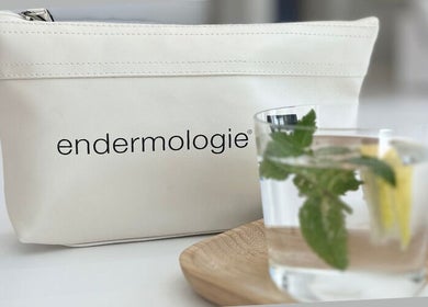 Endermologie & Slimming wellness setup in SOMERSET WEST, Western Cape, ZA with a drink beside a branded bag.