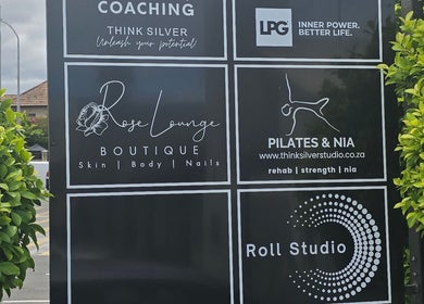 Exterior signage for Endermologie & Slimming at SOMERSET WEST, Western Cape, ZA, highlighting various wellness services.