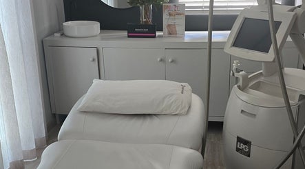 A serene treatment room at Endermologie & Slimming in SOMERSET WEST, Western Cape, ZA, featuring modern equipment.