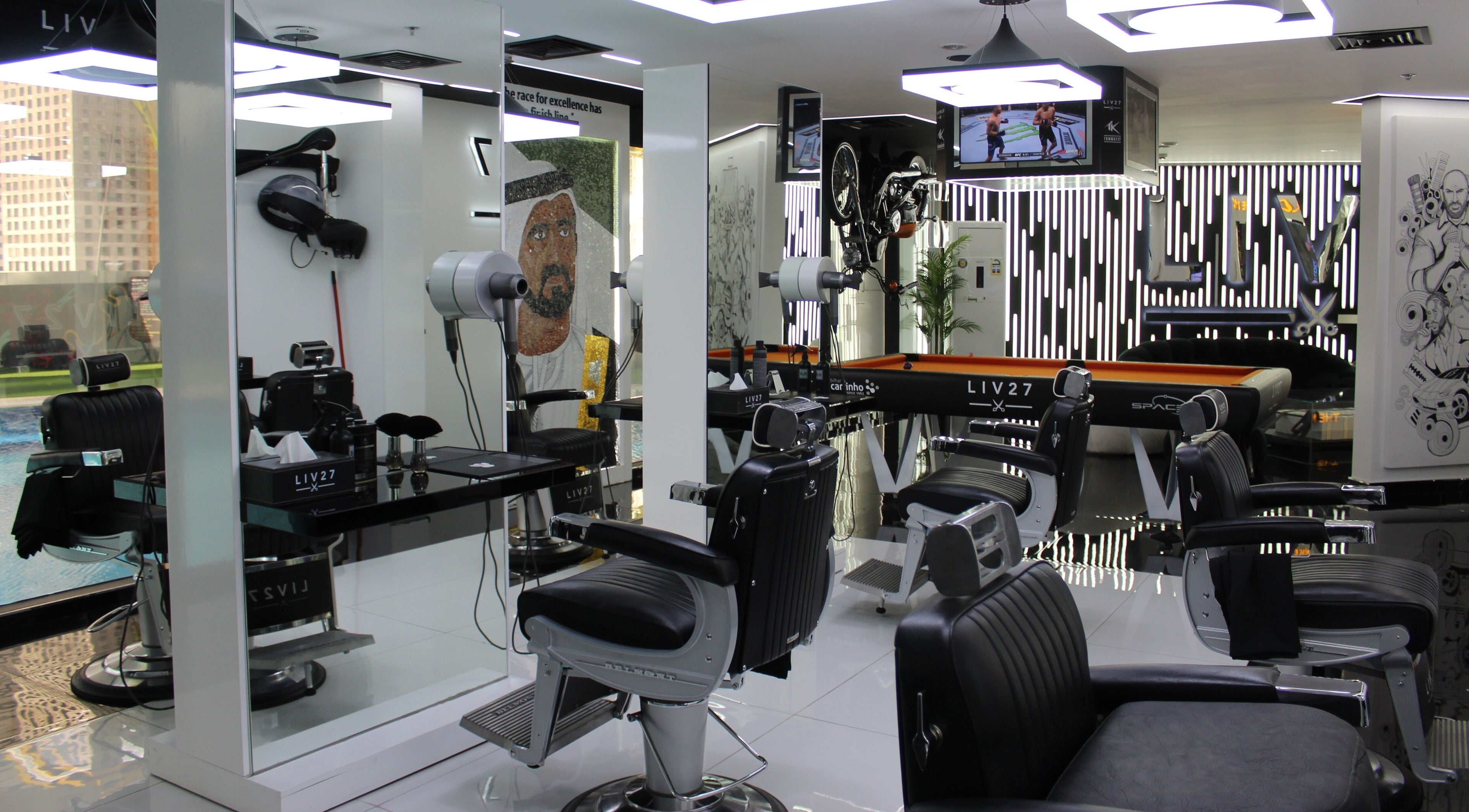 Modern salon interior at LIV27 - Media City Branch, Dubai, Dubai, AE, featuring sleek black chairs and décor.