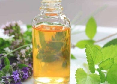 Aromatic essential oil bottle with herbs at The Beauty Garden, Bray, County Wicklow, IE.