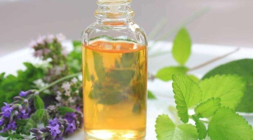 Aromatic essential oil bottle with herbs at The Beauty Garden, Bray, County Wicklow, IE.