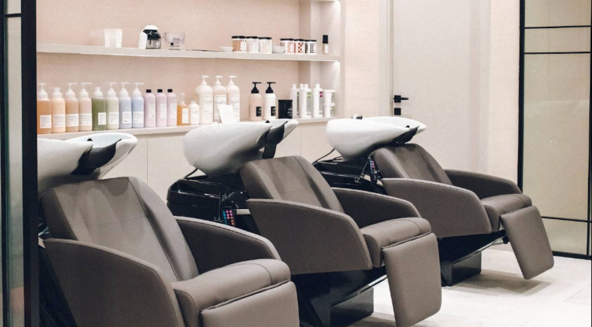 Luxurious shampoo stations at Hair Ltd. in الشارقة, إمارة الشارقةّ, AE showcasing modern salon design.