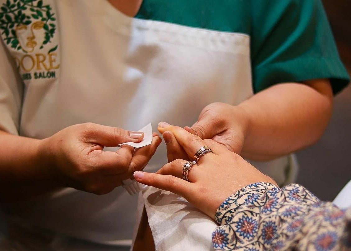 Manicure service in progress at Dore Ladies Salon, Dubai, AE, showcasing expert nail care.