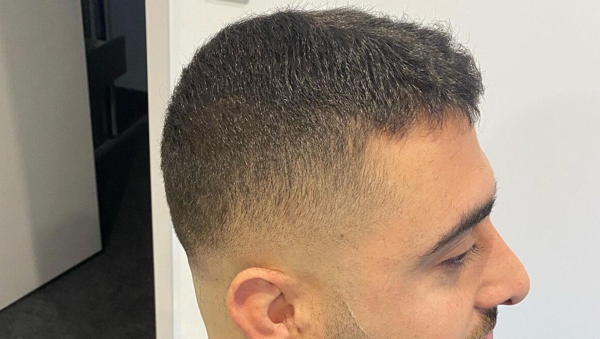 Sleek fade haircut at Van E Cuts, Hillsdale, New South Wales, AU, showcasing precise barbering skills.