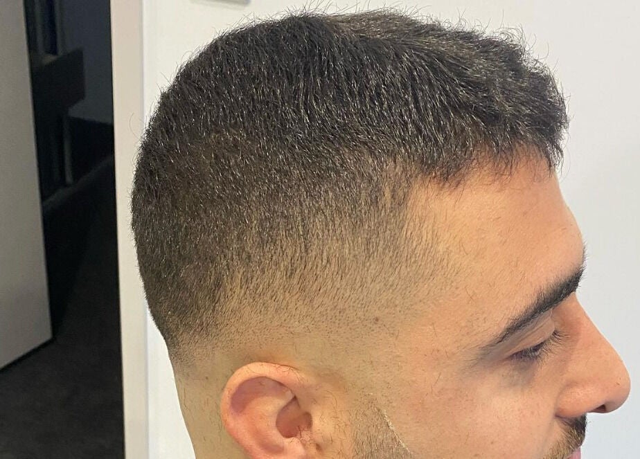 Sleek fade haircut at Van E Cuts, Hillsdale, New South Wales, AU, showcasing precise barbering skills.