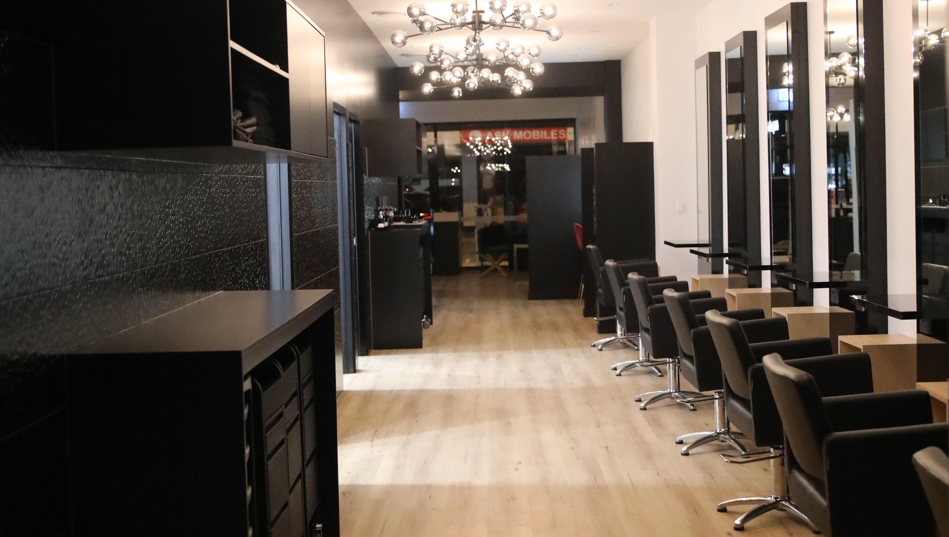 Stylish interior of Mojjatchi | Launceston, TAS, AU with modern hairdressing stations and sleek design.