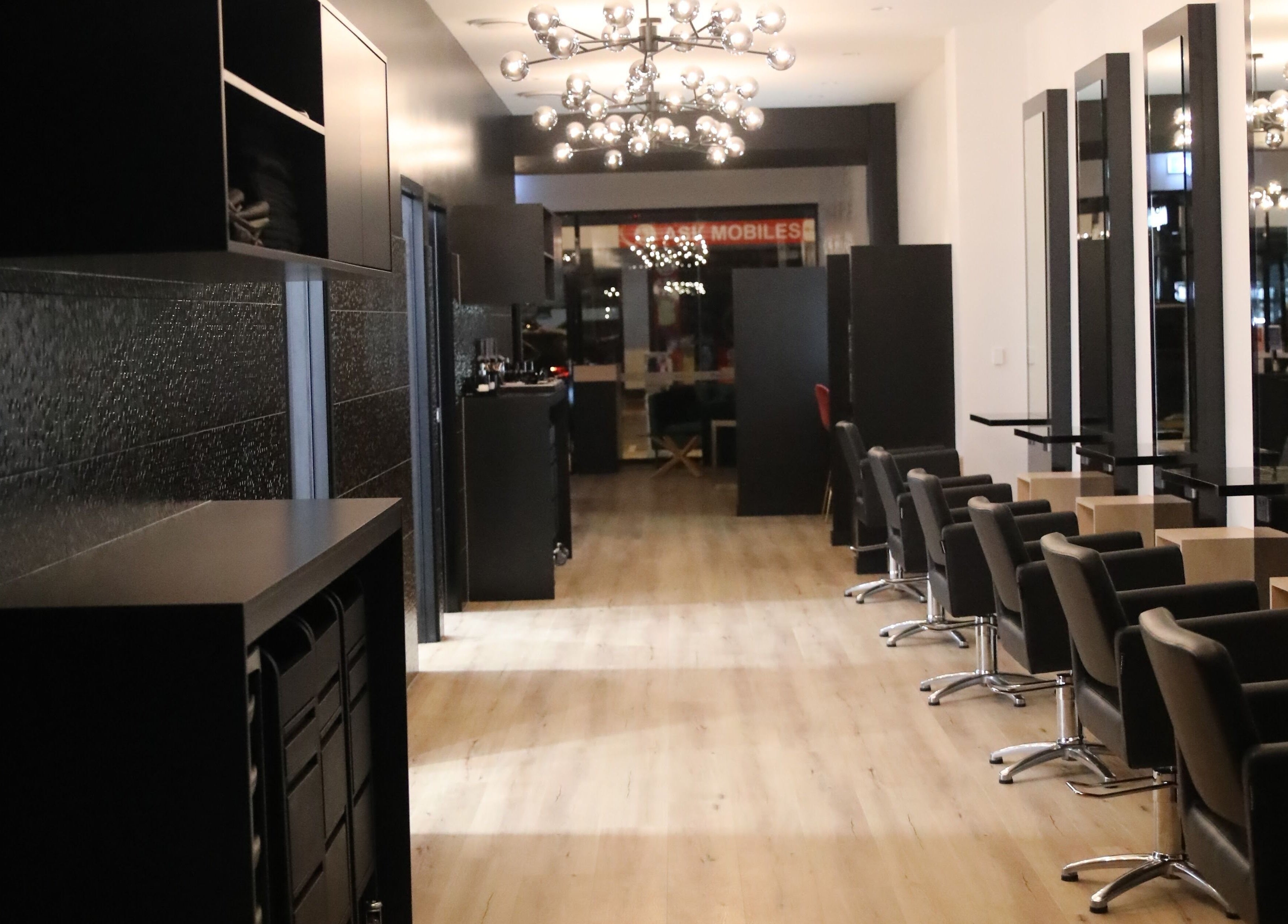 Stylish interior of Mojjatchi | Launceston, TAS, AU with modern hairdressing stations and sleek design.