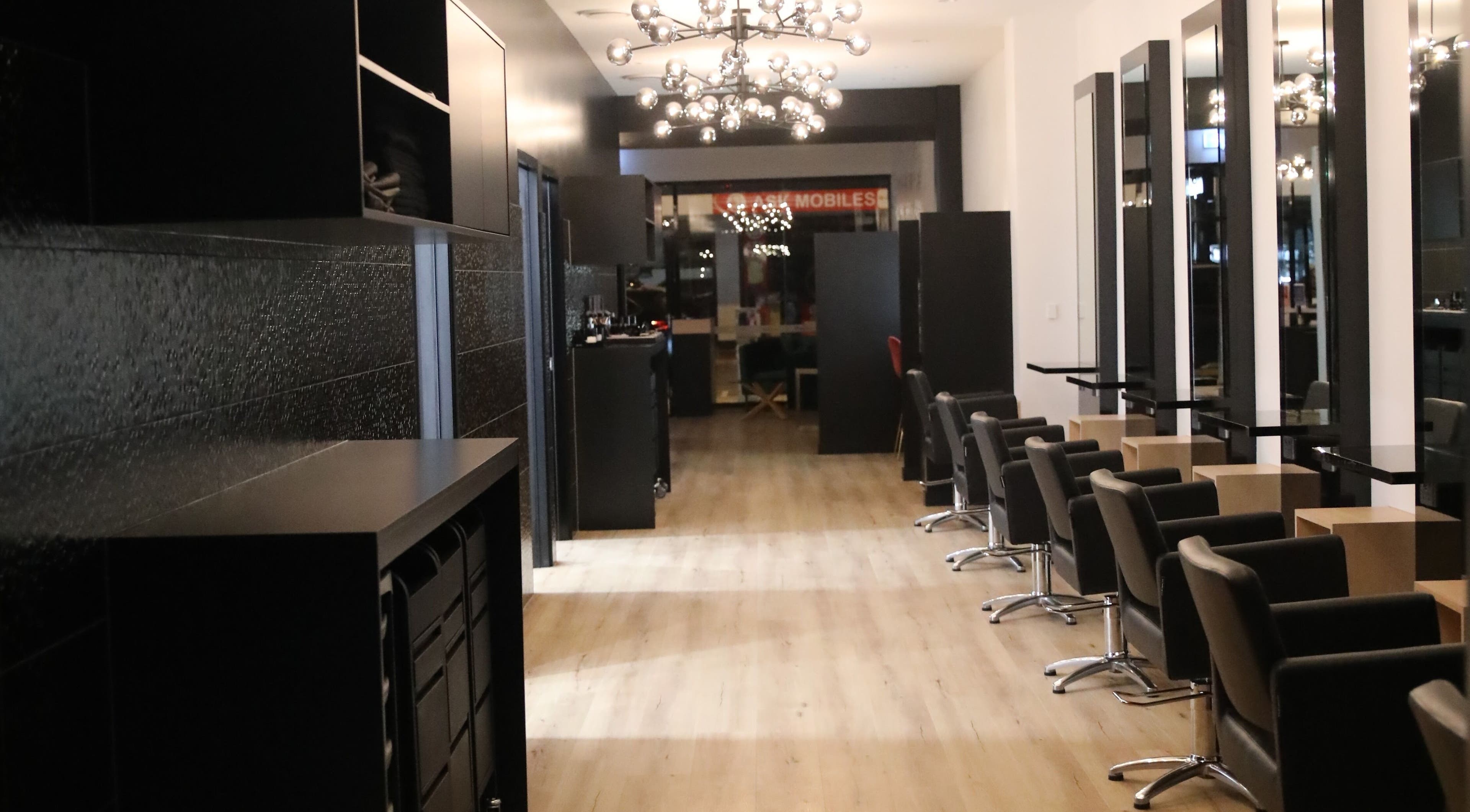 Stylish interior of Mojjatchi | Launceston, TAS, AU with modern hairdressing stations and sleek design.