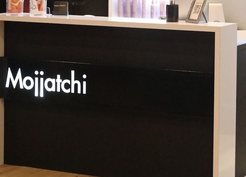 Mojjatchi Launceston's sleek reception desk at Launceston, TAS, AU showcases elegance and style.