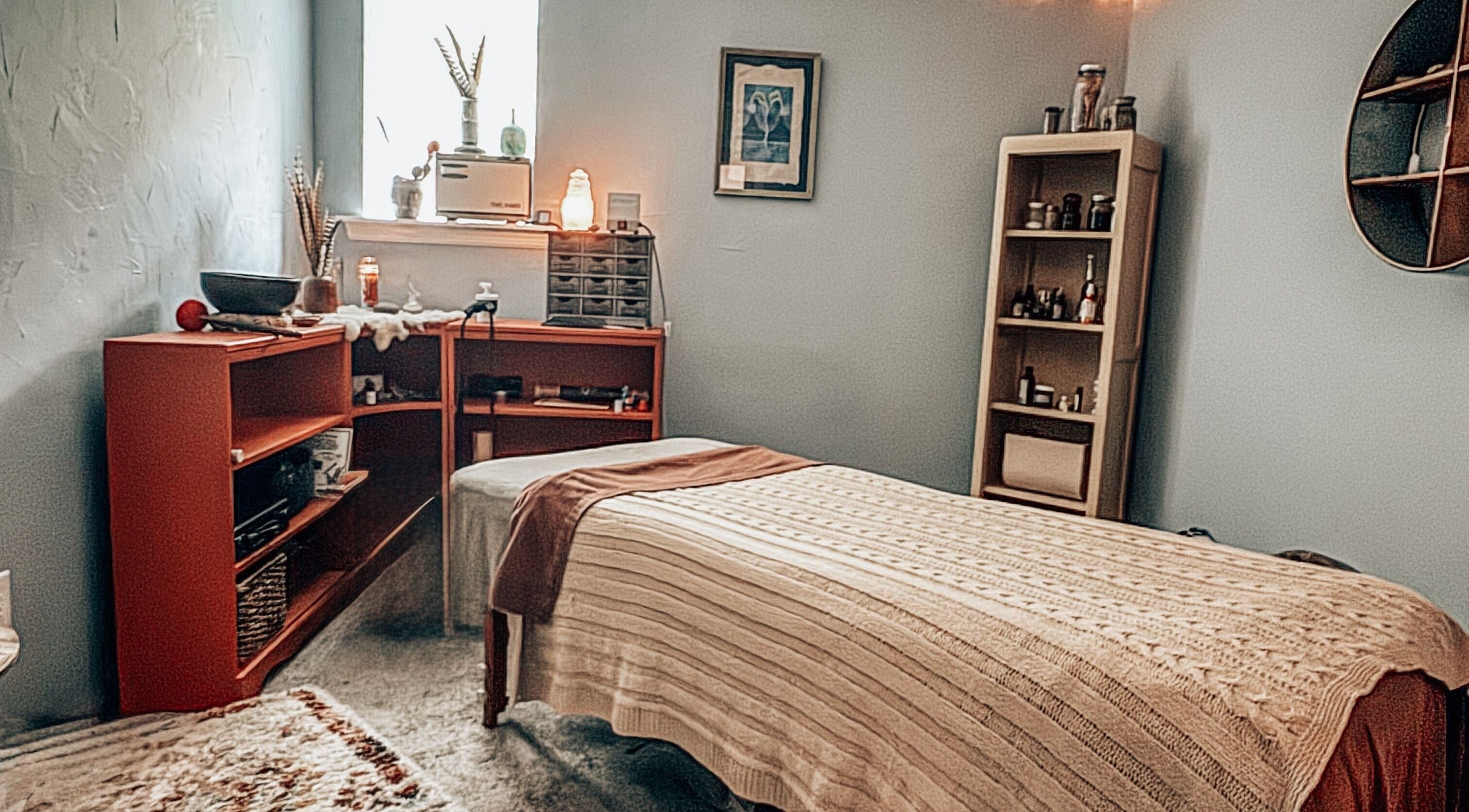 Cozy wellness room at Mama Flowers, Kutztown, Pennsylvania, US with massage table and ambient lighting.