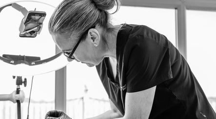 Professional beautician at Finishing Touches Skin & Beauty, York, England, GB, performing precise beauty treatment.