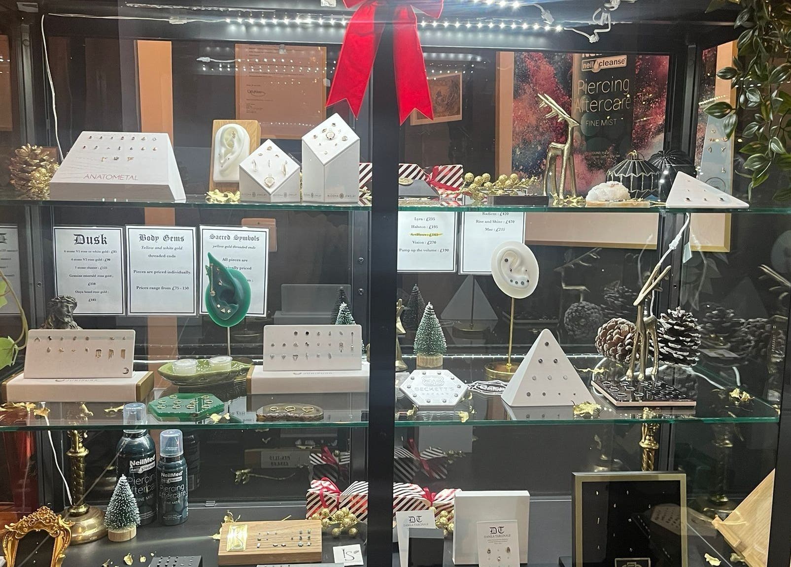 Jewelry showcase at Black Abbey Tattoo and Piercing, Glasgow, Scotland, GB, featuring earrings and ornaments.
