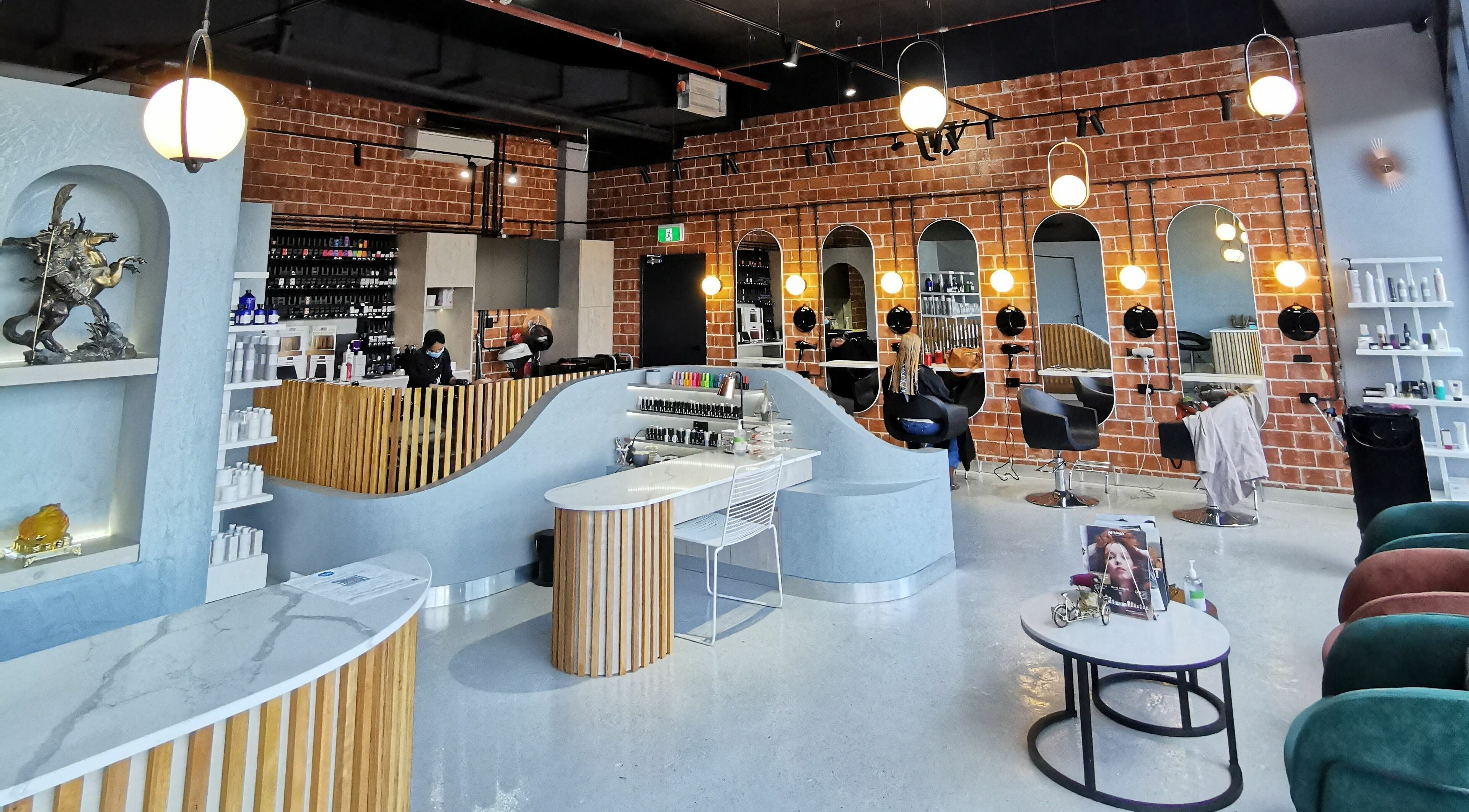 Modern interior of Ivy Hairdressing and Beauty Salon in Parramatta, New South Wales, AU. Stylish chairs and decor.