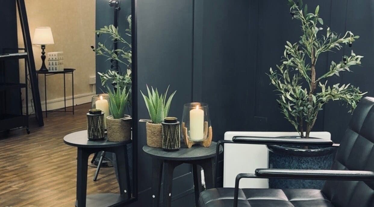 Cozy corner with plants and candles at Scott McKinnon Aesthetics and Skin Clinic, Saltcoats, Scotland, GB.