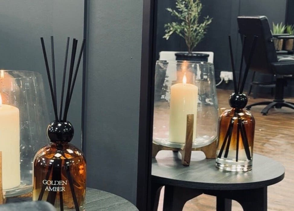 Candle and diffuser at Scott McKinnon Aesthetics and Skin Clinic, Saltcoats, Scotland, GB, enhance cozy atmosphere.