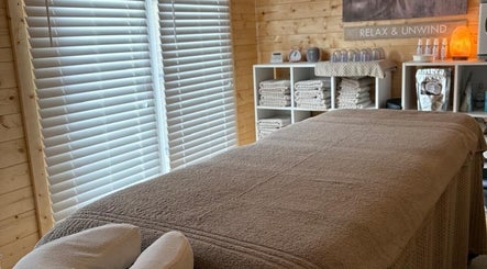 Relaxing therapy room at Rio Bluebell Therapies, Salisbury, England, GB, featuring a cozy massage table.