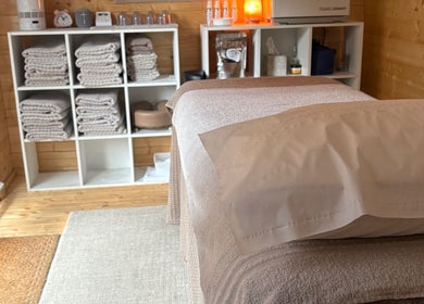 Relaxing therapy room at Rio Bluebell Therapies, Salisbury, England, GB with massage table and soft lighting.