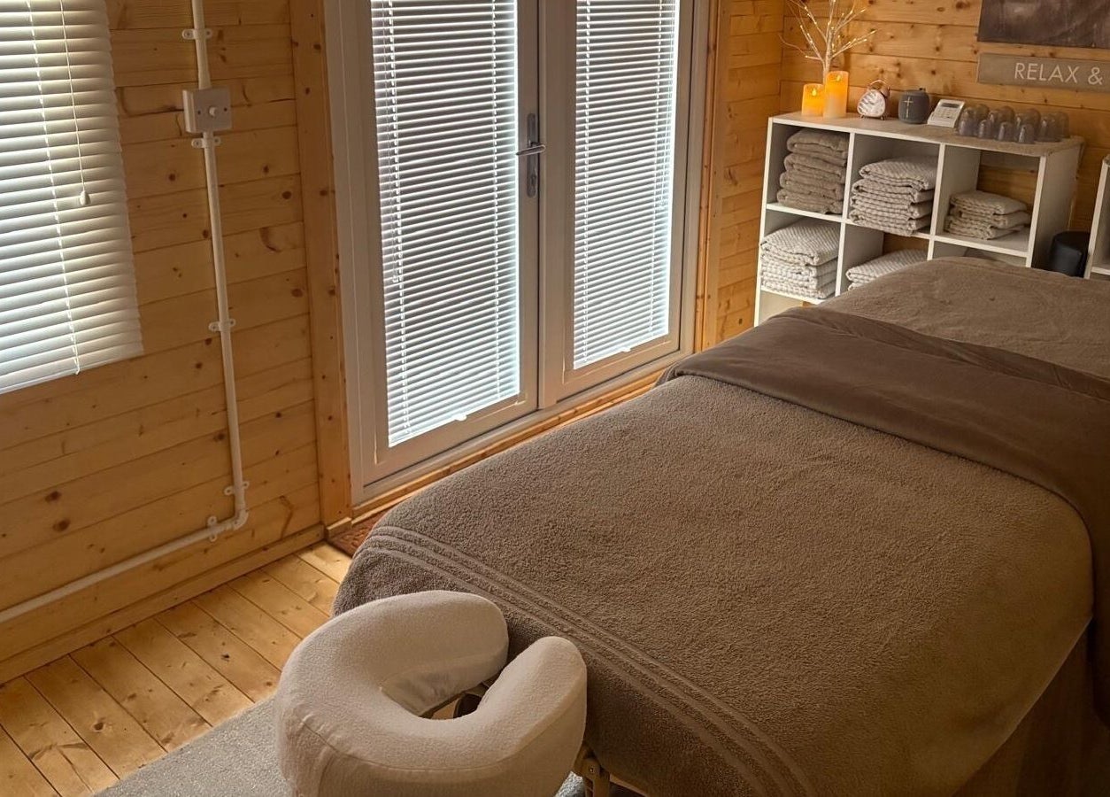 Relaxing spa room at Rio Bluebell Therapies, Salisbury, England, GB with massage table and calming decor.