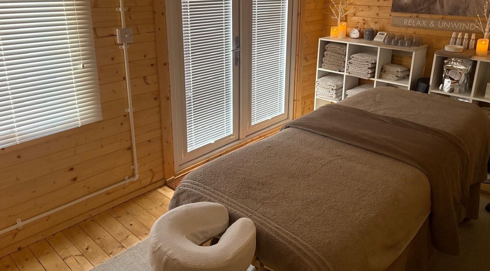 Relaxing spa room at Rio Bluebell Therapies, Salisbury, England, GB with massage table and calming decor.