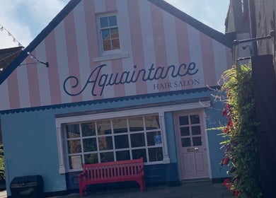 Exterior of Aquaintance Hair Salon with pink facade in Darlington, England, GB.