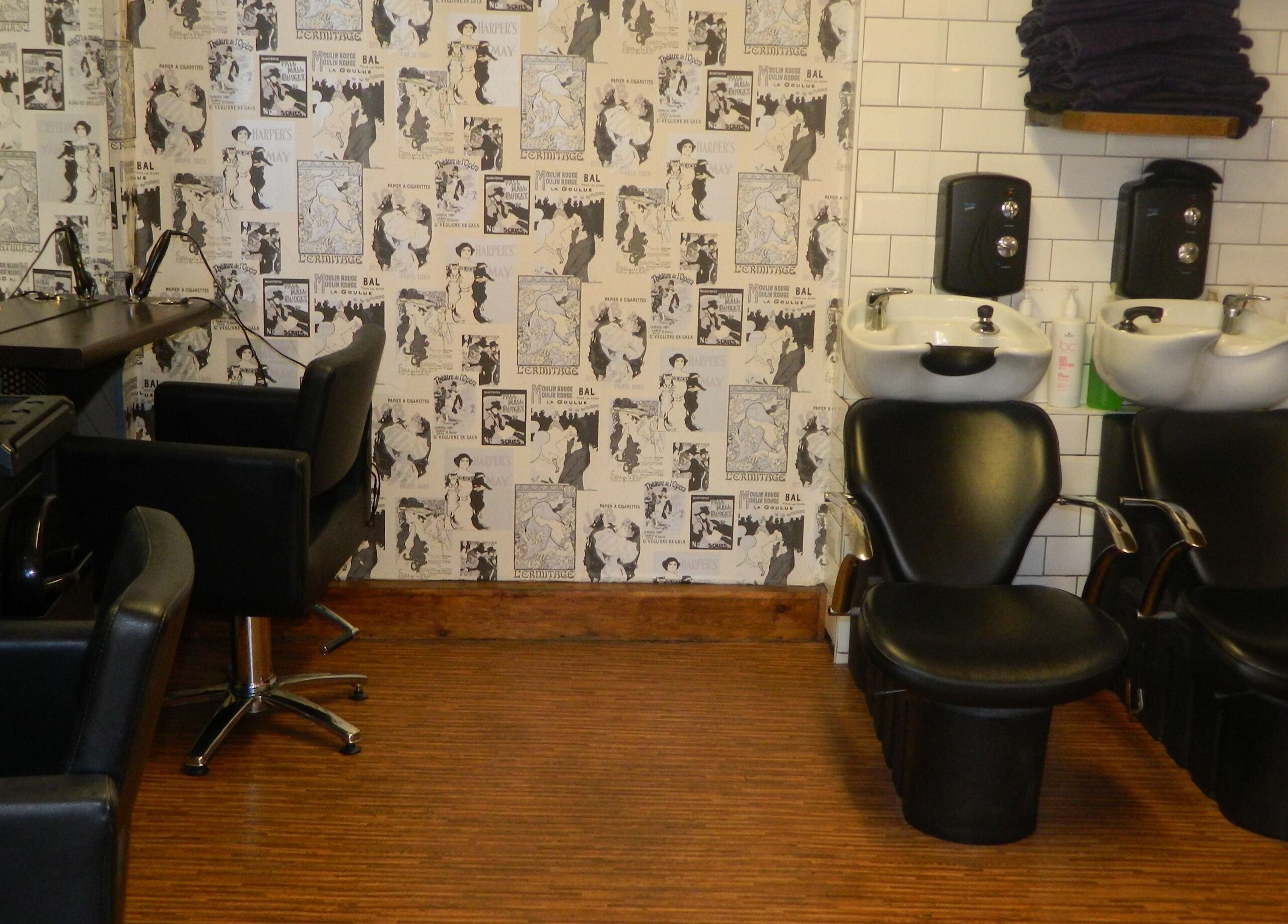 Stylish interior of Aquaintance Hair Salon with salon chairs and sinks in Darlington, England, GB.