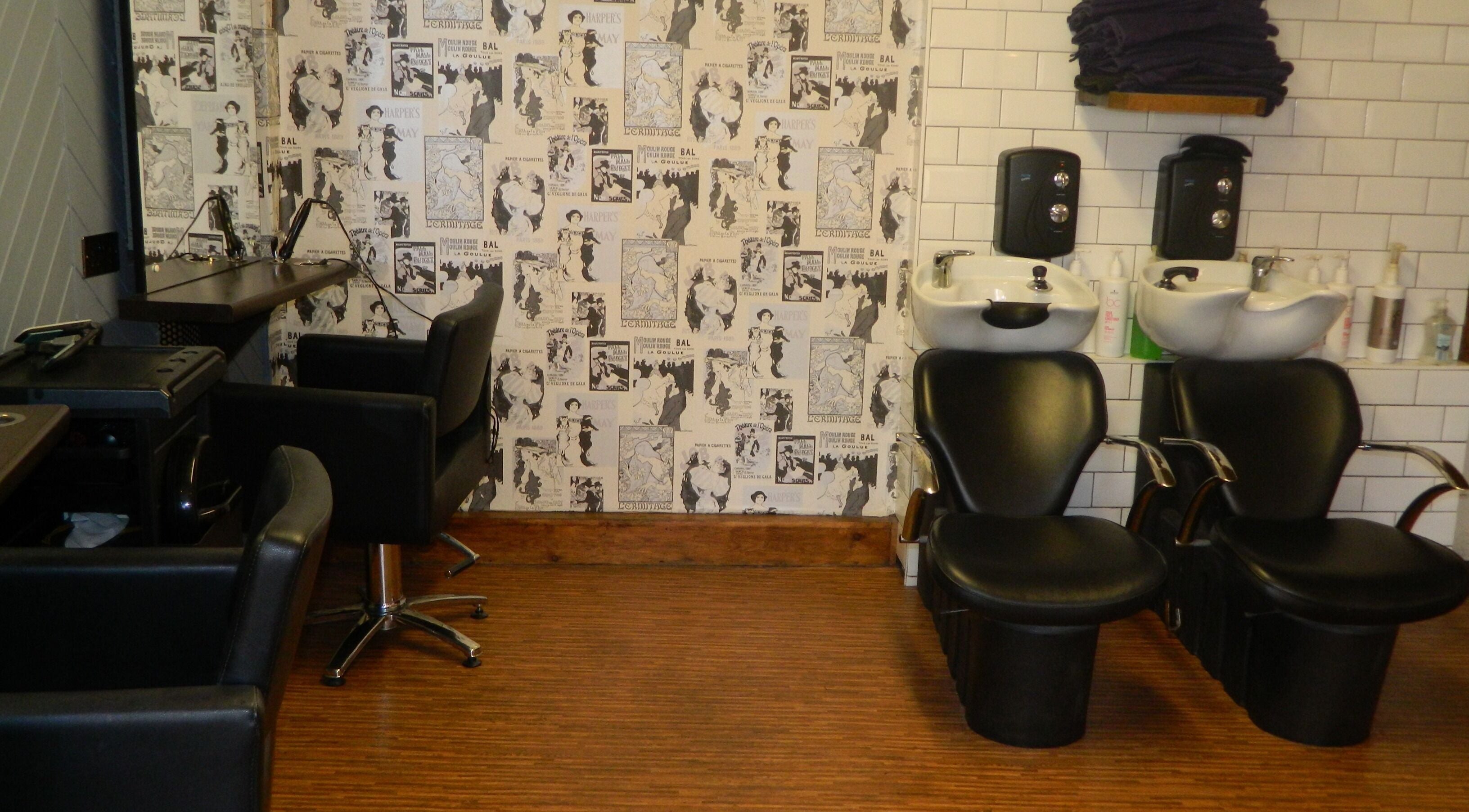 Stylish interior of Aquaintance Hair Salon with salon chairs and sinks in Darlington, England, GB.
