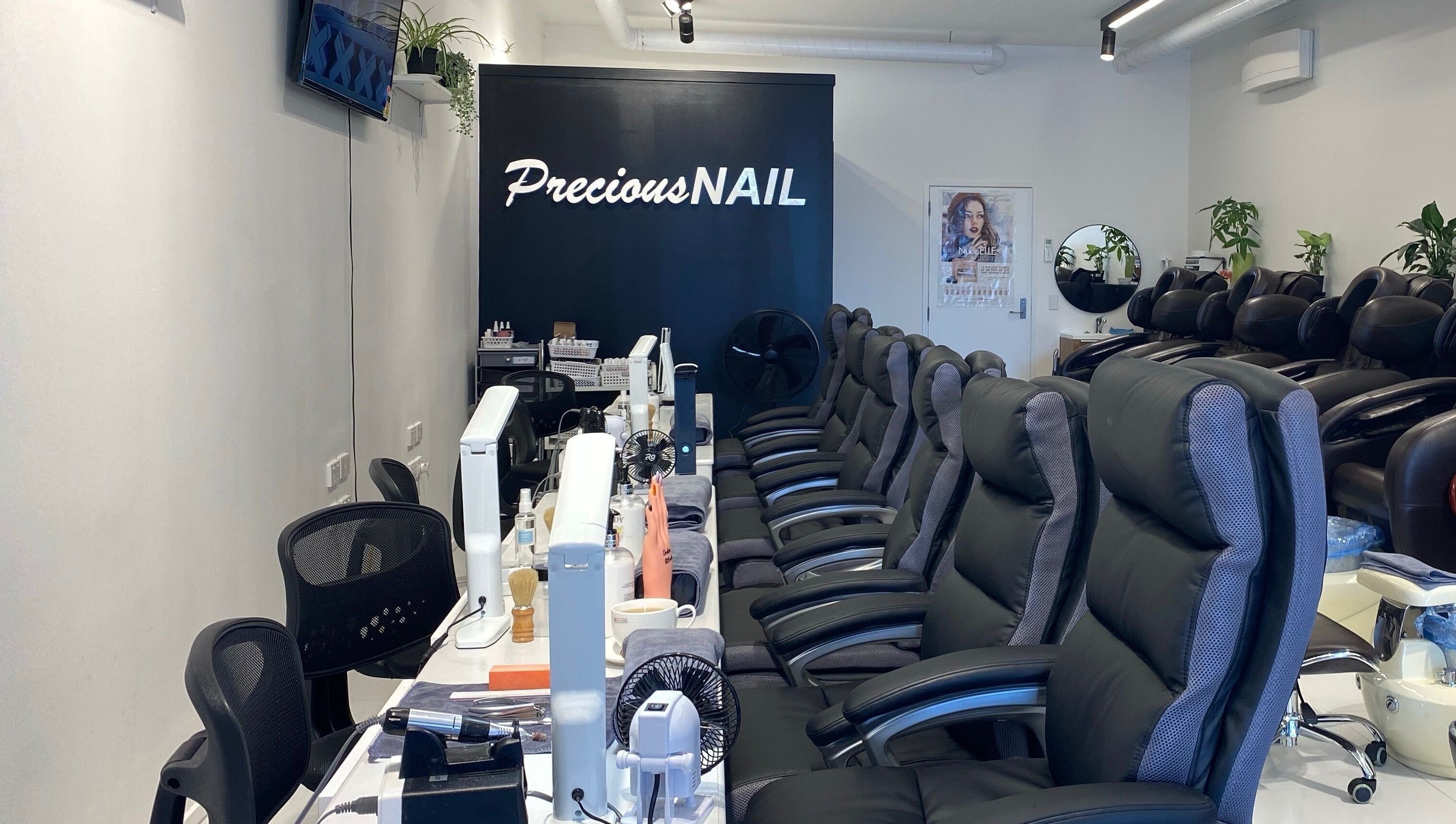 Interior view of Precious Nail, Auckland, NZ showing elegant nail care seating and tools.