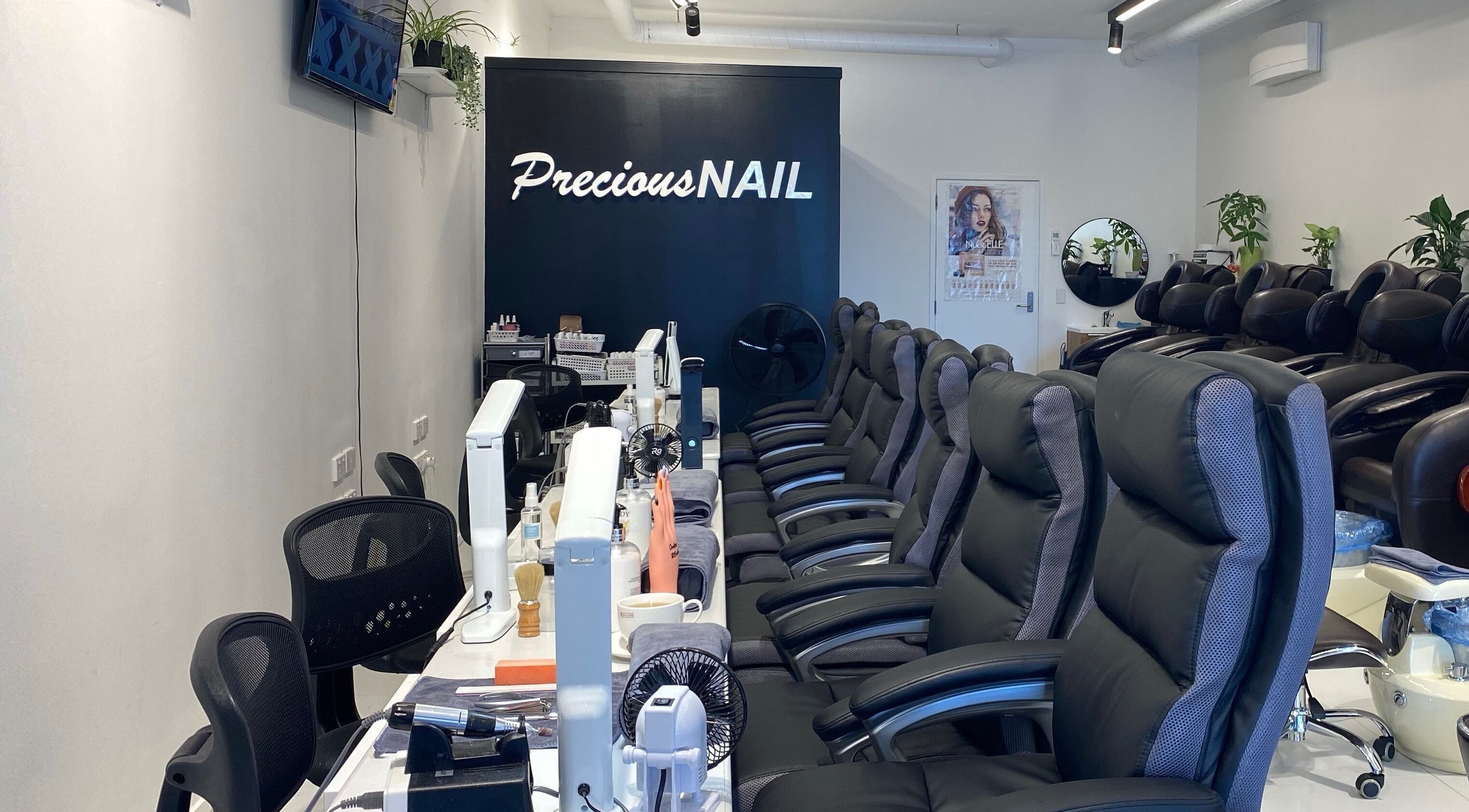 Interior view of Precious Nail, Auckland, NZ showing elegant nail care seating and tools.