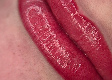 Glossy red lips close-up at Timeless Beauty Aesthetics, Emalahleni, Mpumalanga, ZA. Lip care and aesthetics.