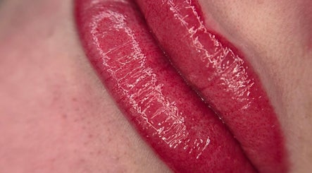 Glossy enhanced lips at Timeless Beauty Aesthetics in Emalahleni, Mpumalanga, ZA shining with vibrant color.