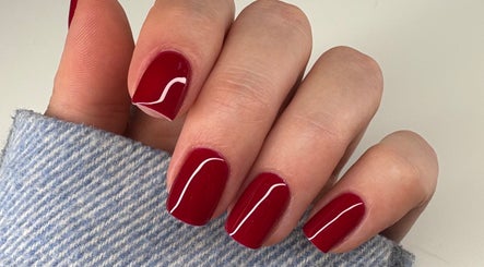 Styled red manicure from Nails by Sonya Stark, Leeds, England, GB showcases refined nail art.