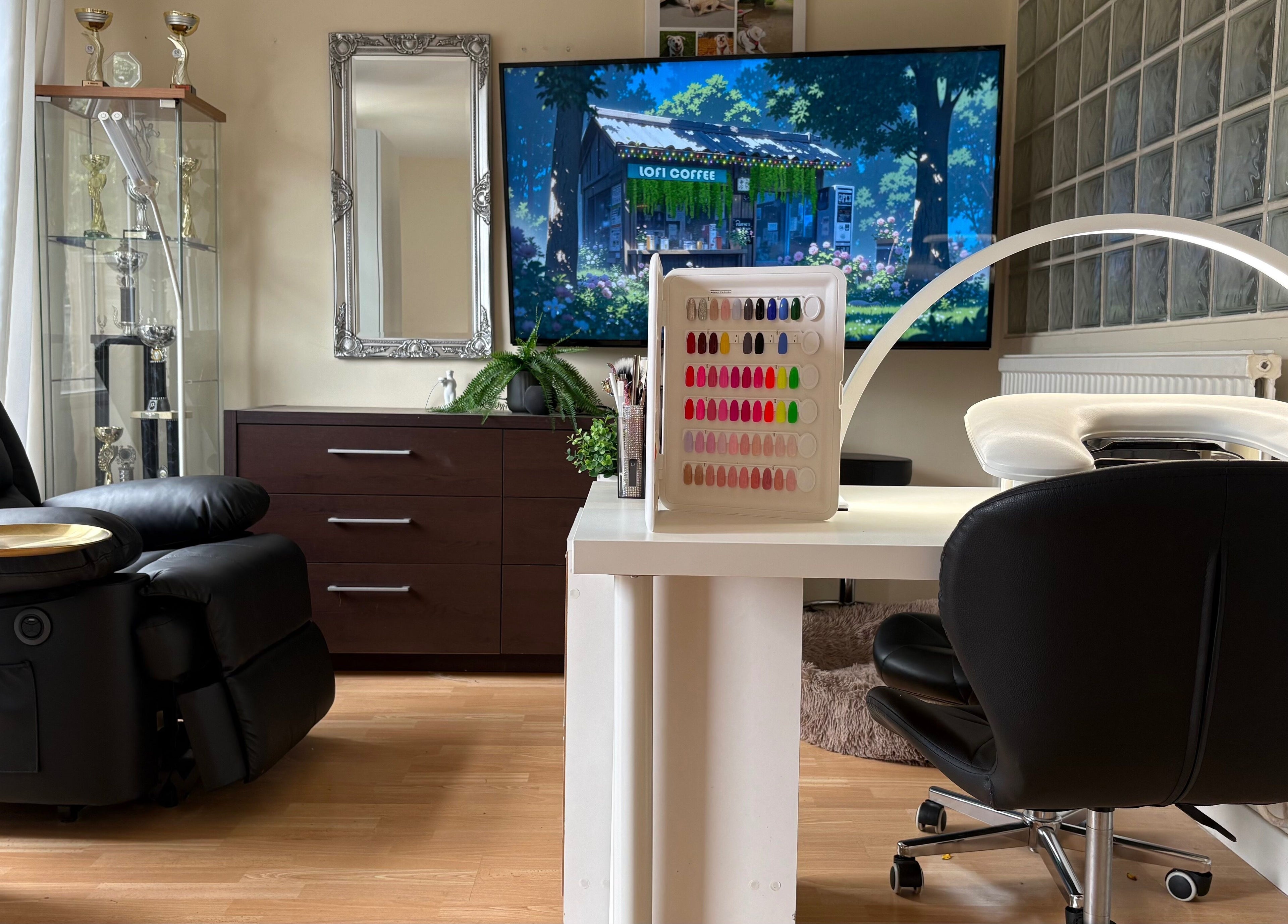 Modern nail studio at Nails By Sonya Stark, Leeds, England, GB, featuring sleek furniture and vibrant nail colors.