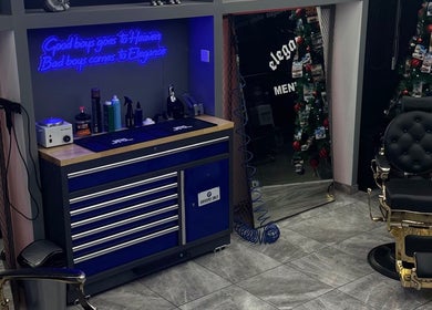 Modern barber station at Elegance Studio Barbers, Paphos, Paphos, CY with neon sign and vintage chair.