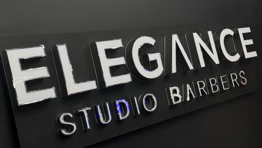 Signage of Elegance Studio Barbers in Paphos, CY, showcasing modern design.