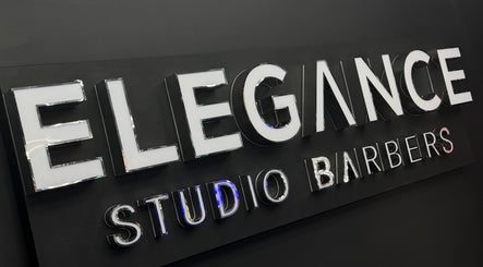 Signage of Elegance Studio Barbers in Paphos, CY, showcasing modern design.