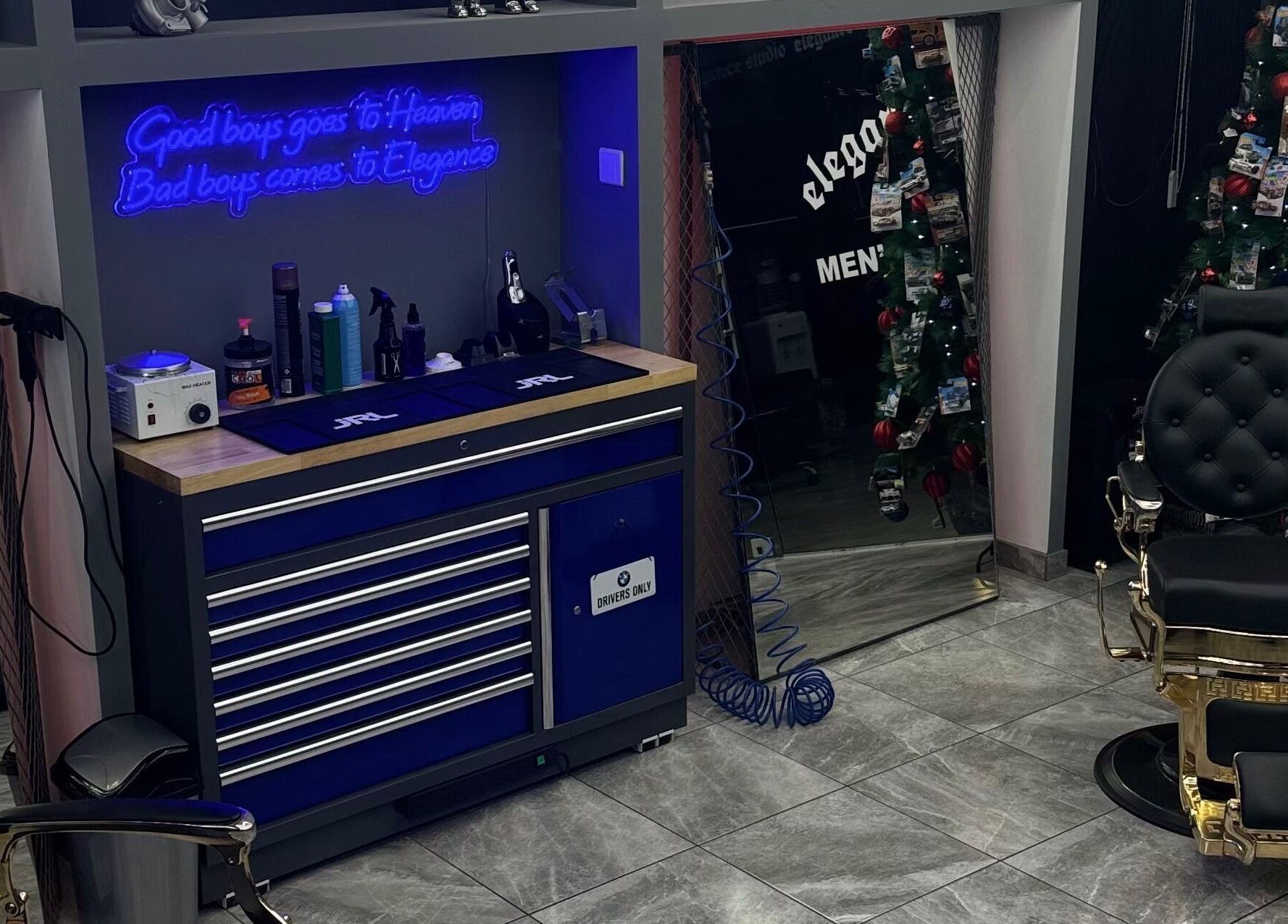 Stylish barber setup with neon sign at Elegance Studio Barbers, Paphos, Paphos, CY.