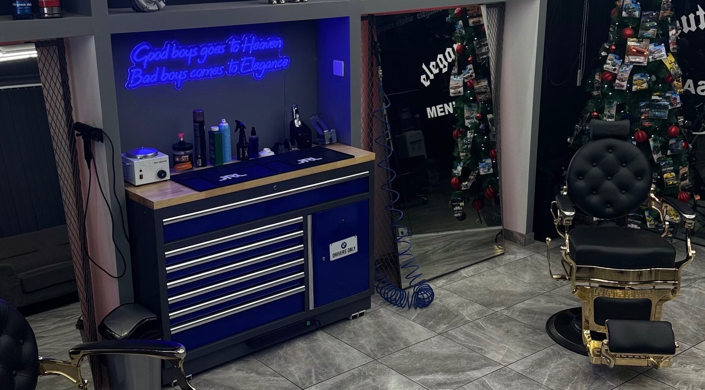 Stylish barber setup with neon sign at Elegance Studio Barbers, Paphos, Paphos, CY.