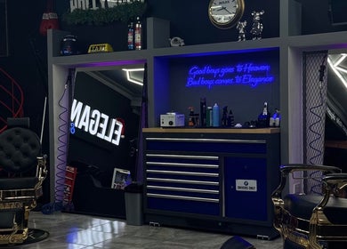 Stylish interior of Elegance Studio Barbers in Paphos, CY featuring luxury barber chairs and modern decor.