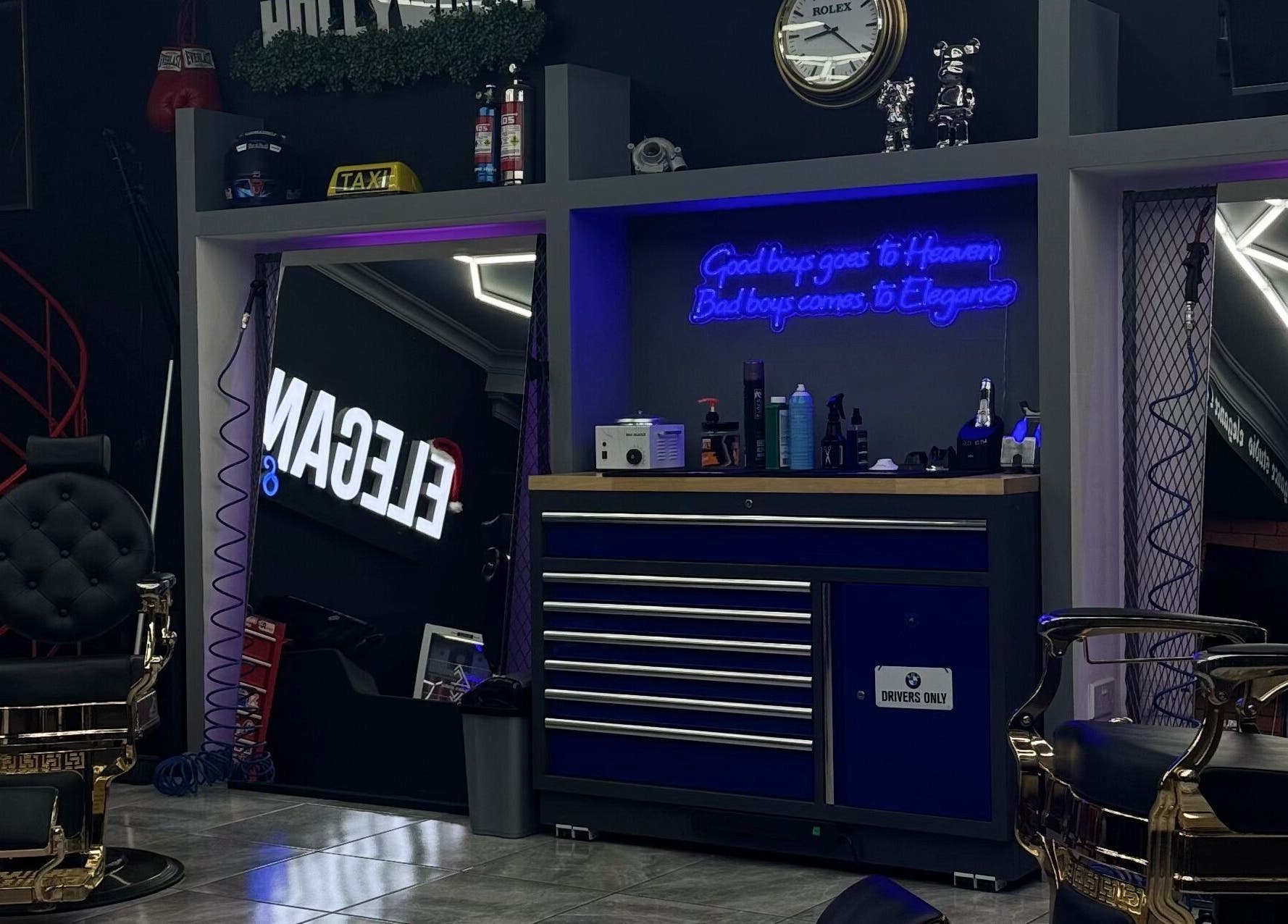 Stylish interior of Elegance Studio Barbers in Paphos, CY featuring luxury barber chairs and modern decor.