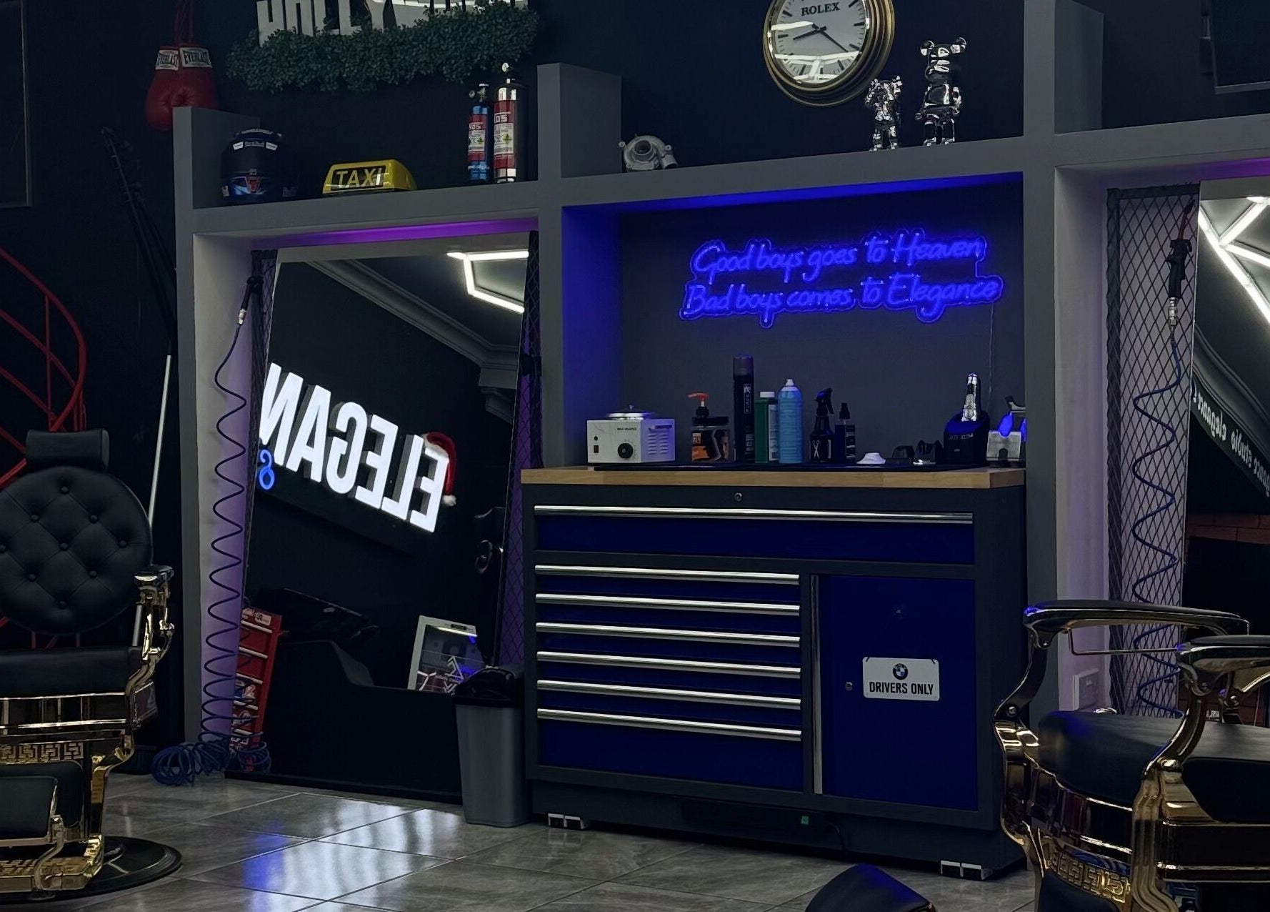 Stylish interior of Elegance Studio Barbers in Paphos, CY featuring luxury barber chairs and modern decor.