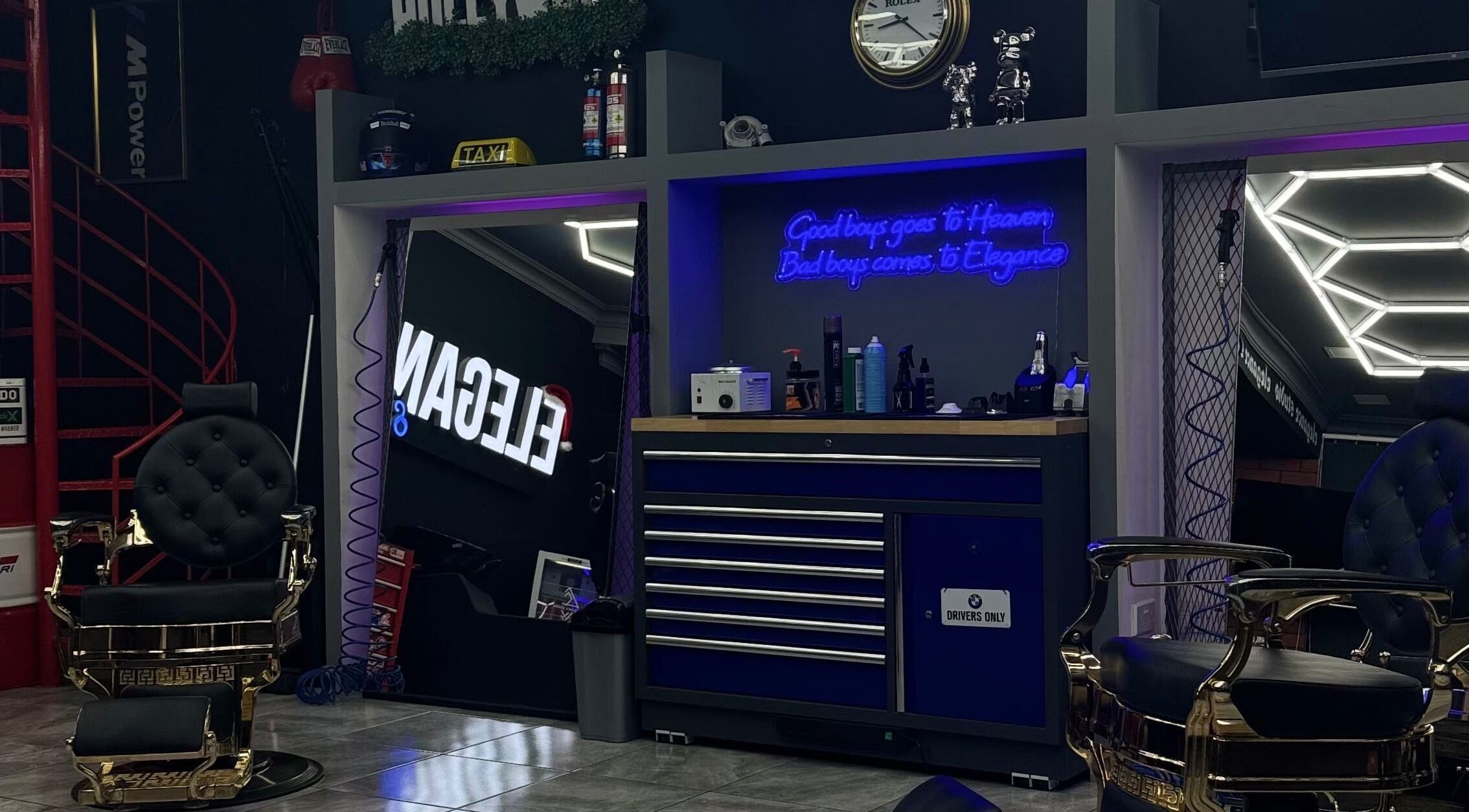 Stylish interior of Elegance Studio Barbers in Paphos, CY featuring luxury barber chairs and modern decor.