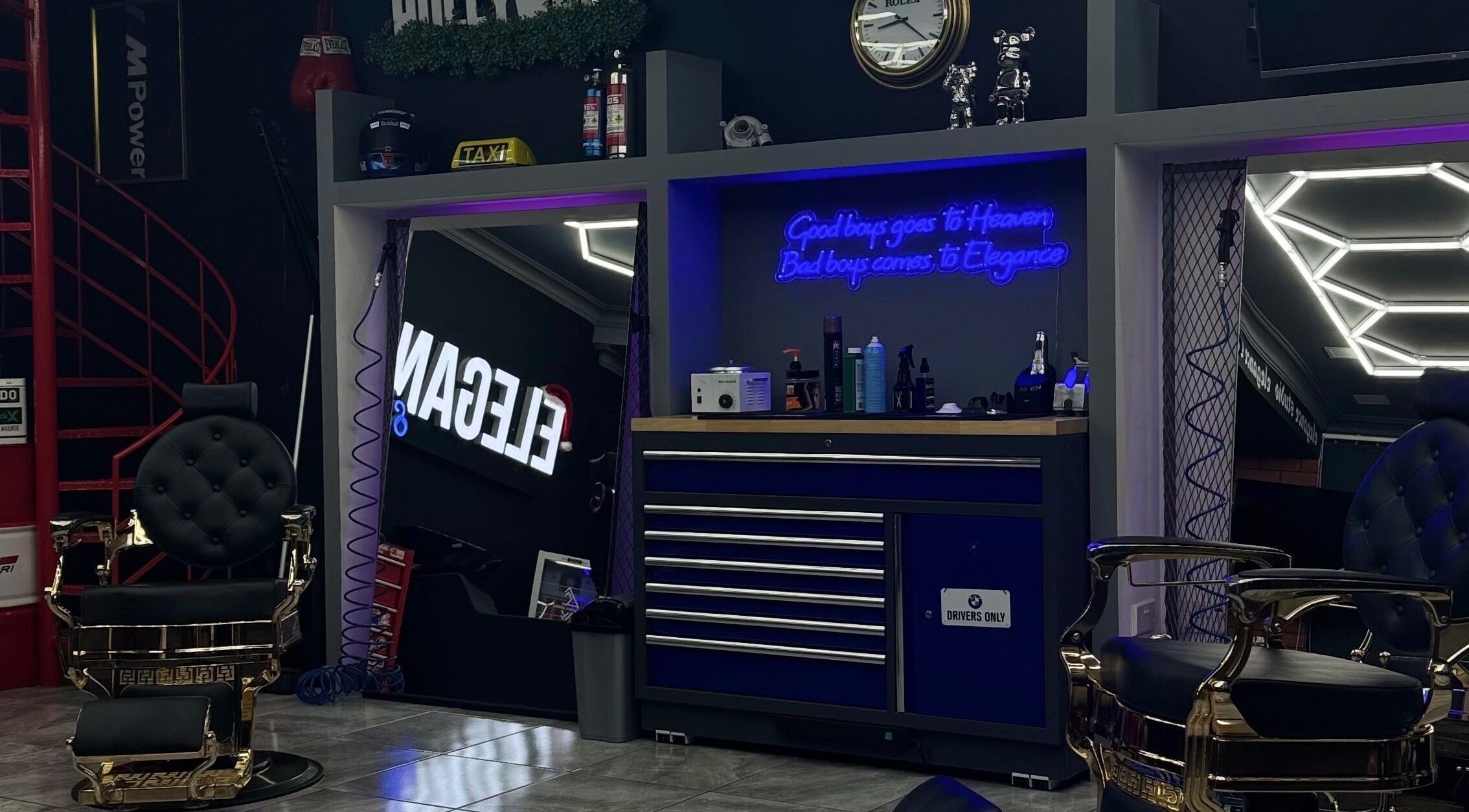 Stylish interior of Elegance Studio Barbers in Paphos, CY featuring luxury barber chairs and modern decor.