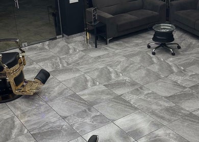 Interior of Elegance Studio Barbers in Paphos, CY, featuring stylish barber chair and sleek decor.