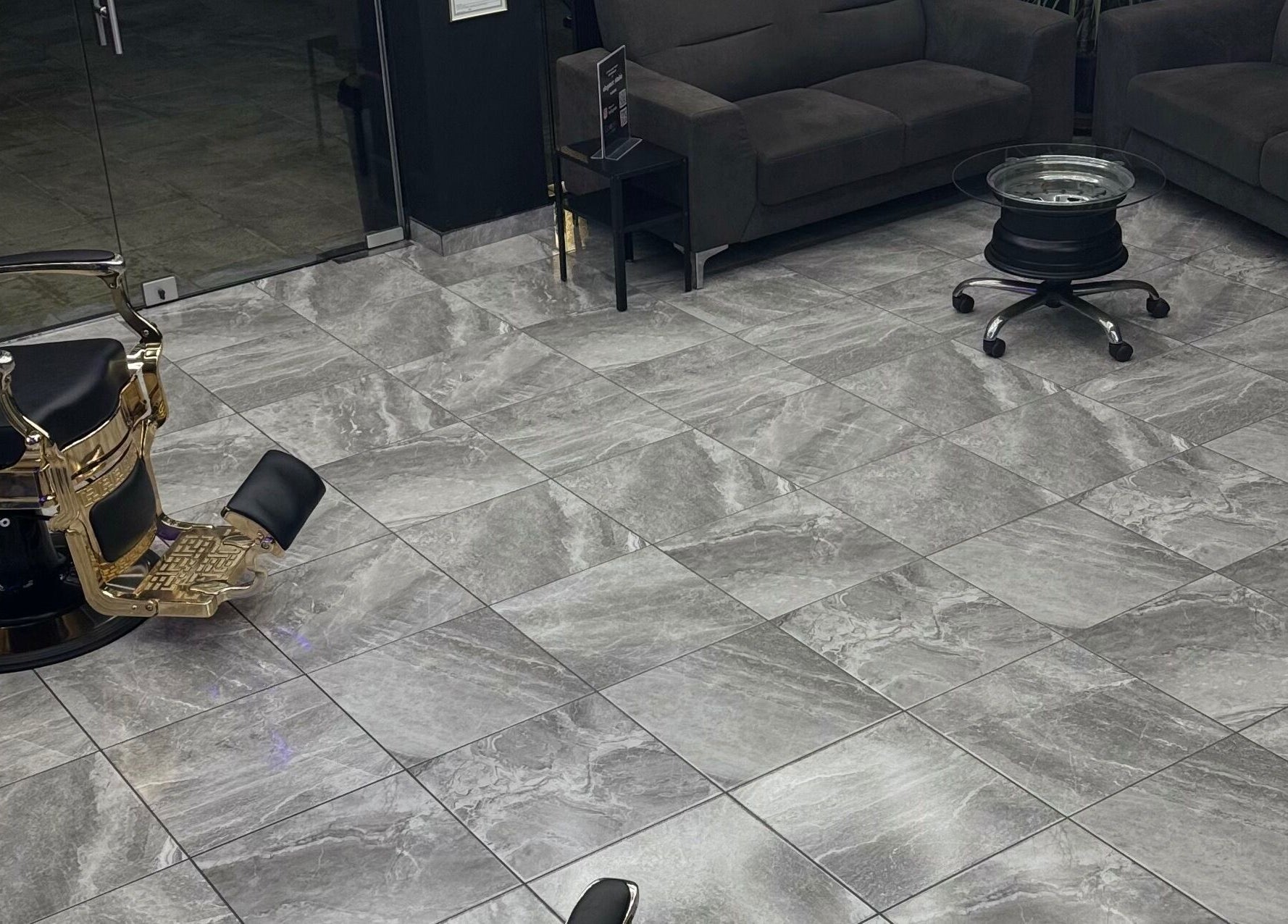 Interior of Elegance Studio Barbers in Paphos, CY, featuring stylish barber chair and sleek decor.