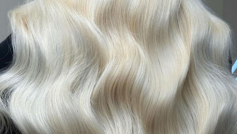 Luxurious silky blonde hair at Luxe Hair, Aberdeen, Scotland, GB, showcasing expert styling and color.