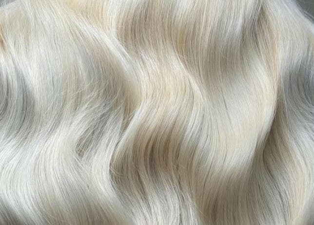 Luxurious silky blonde hair at Luxe Hair, Aberdeen, Scotland, GB, showcasing expert styling and color.